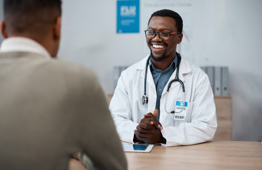 Black man doctor with patient in consultation office for healthcare advice, services and profession